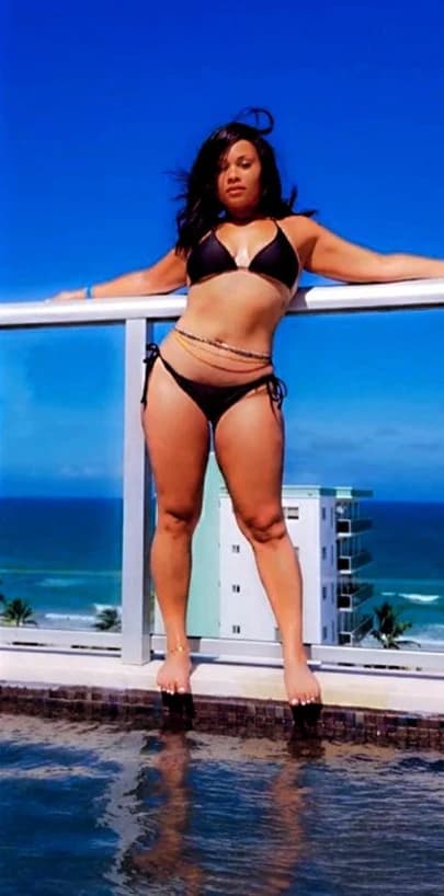 After: the same client, visibly slimmer, posing by the ocean