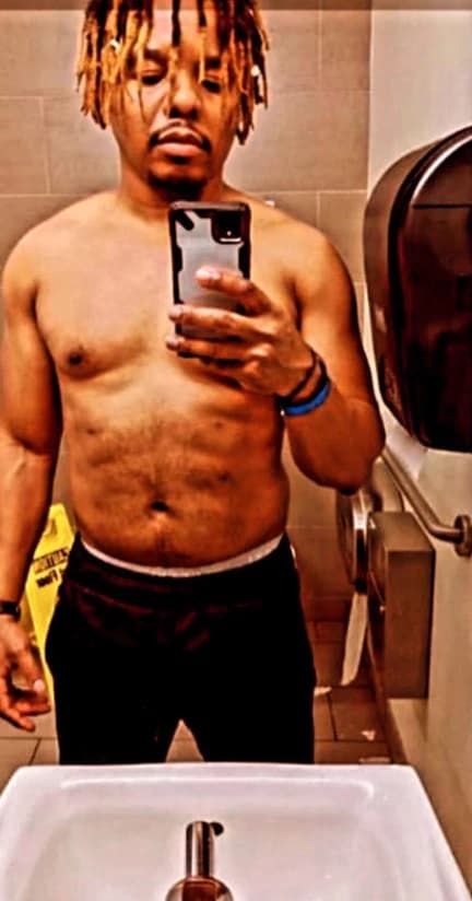 Before: a client taking a shirtless mirror selfie